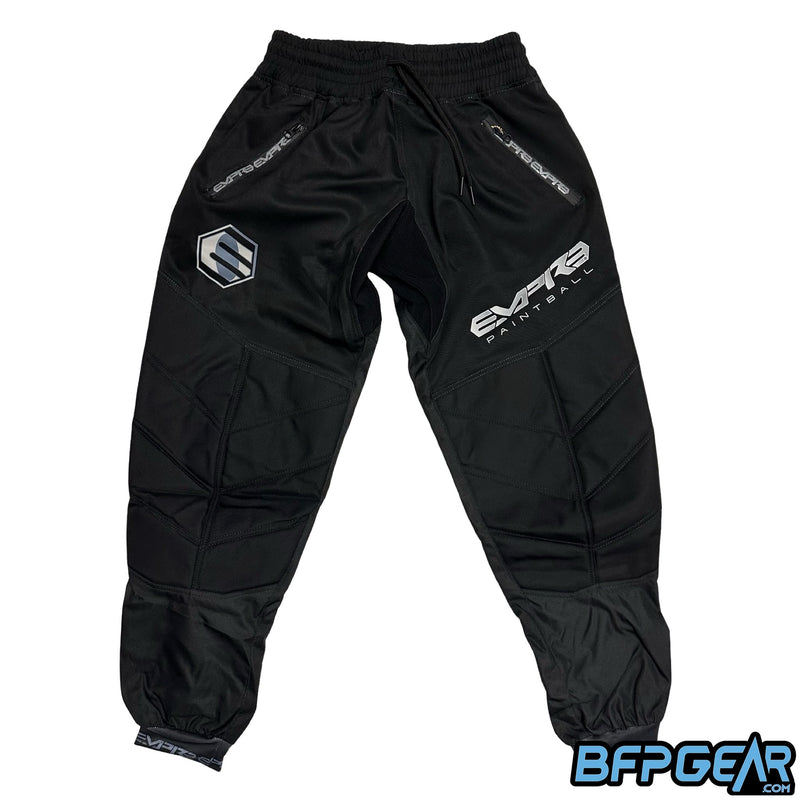 The front of the Empire Classic Pant in Black and Grey. All black pants with the grey Empire logo just above the knee.