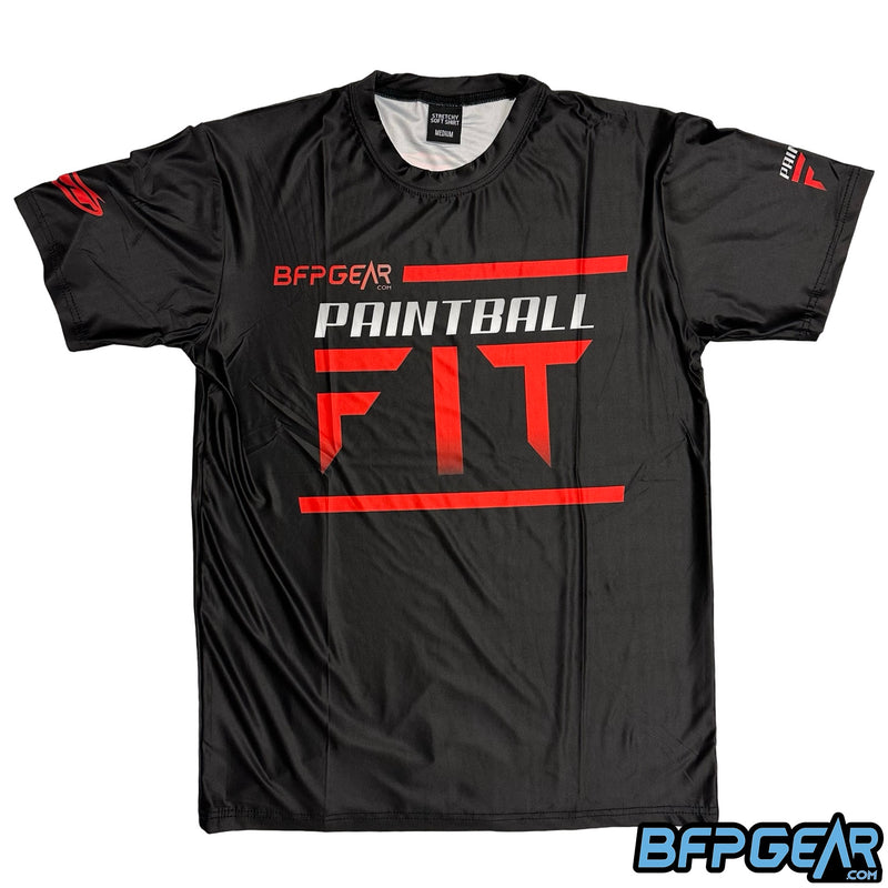 The front of the Paintball Fit Stretchy Soft shirt, 2025 design. This is a black shirt with Paintball Fit's team logo. The left sleeve has the JT banana logo, and the right sleeve has a smaller version of the PBFit logo.