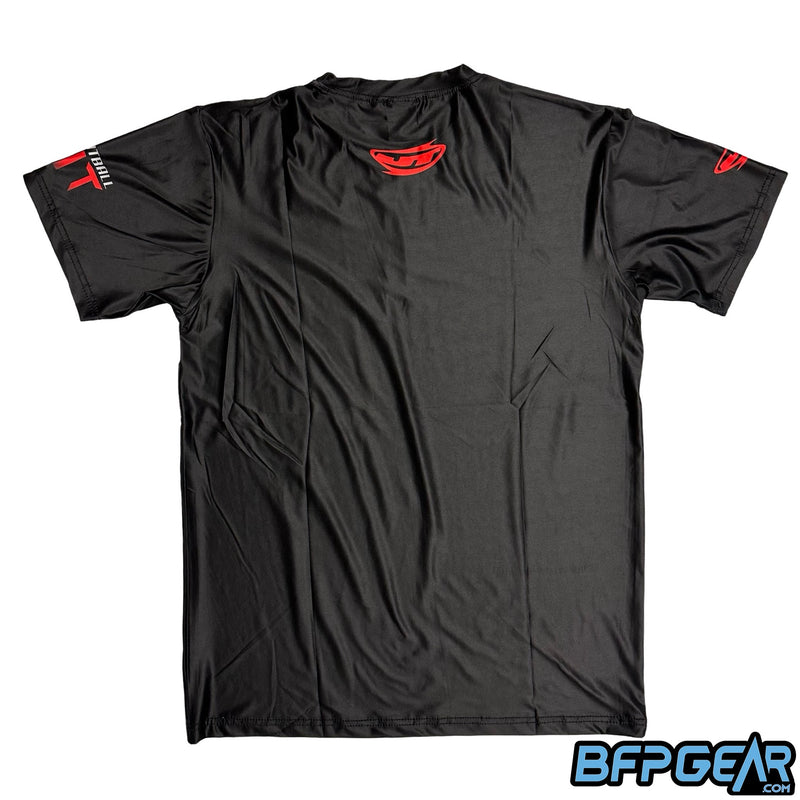 The back of the Paintball Fit stretchy soft shirt. Black shirt with the JT Banana logo in red is over the back of the neck.