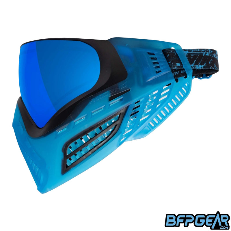 The Vio Ascend SE Black Cyan facing left. These special edition goggles come with the 4-point strap, triple layered foam, and the Cyan color is translucent.